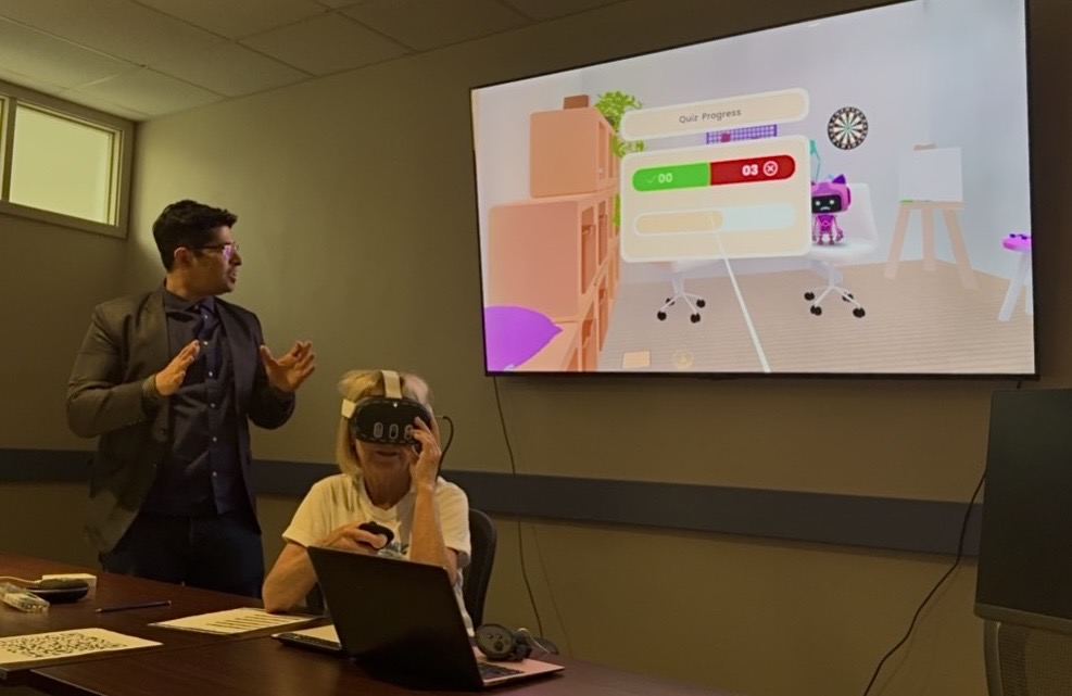 Participants viewing Immersive Mind & Memory Program (IMMP) content during a guided Simple French with Hems workshop