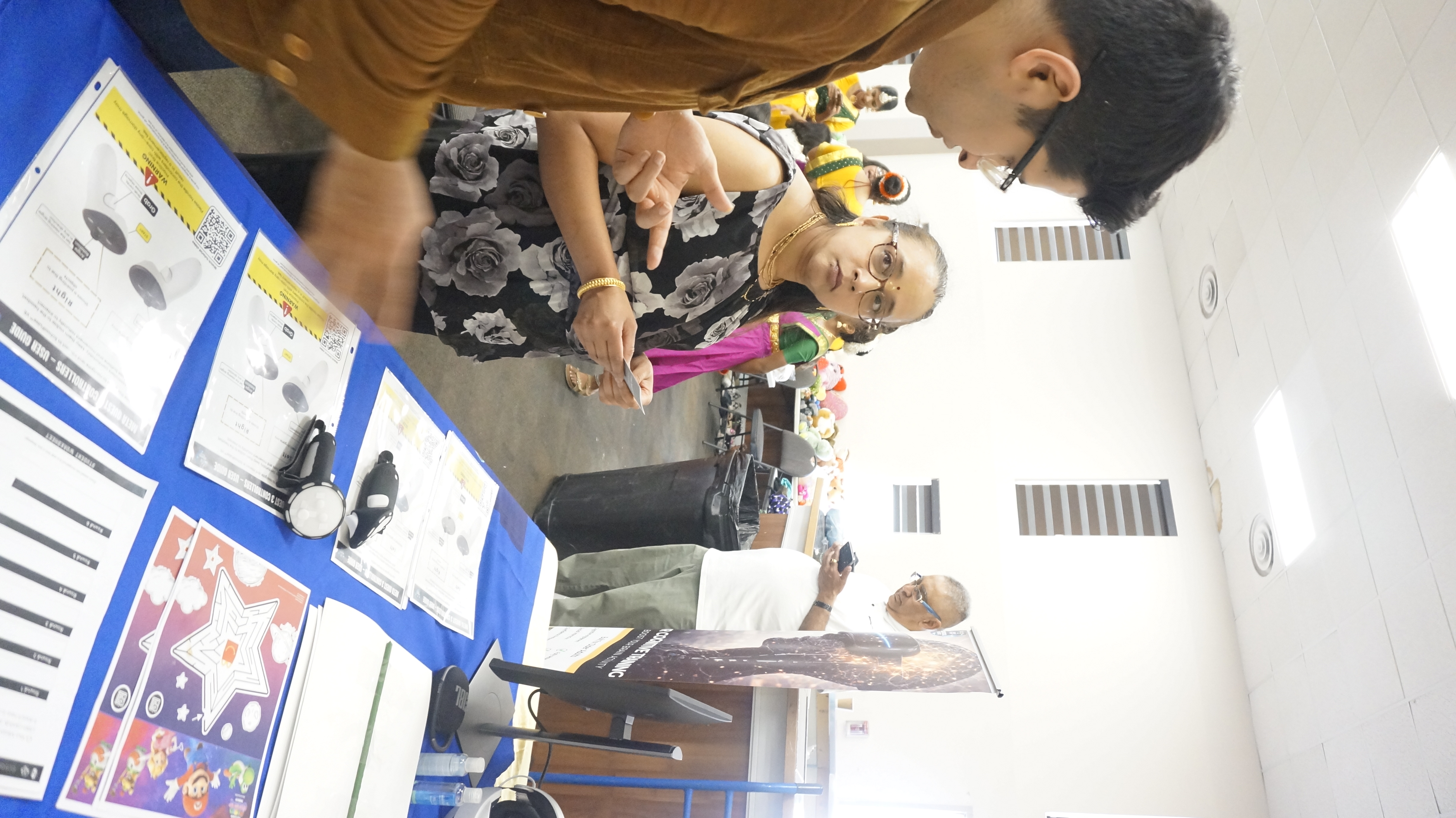 Facilitator supporting a participant at a Immersive Mind & Memory Program (IMMP) station during a live workshop
