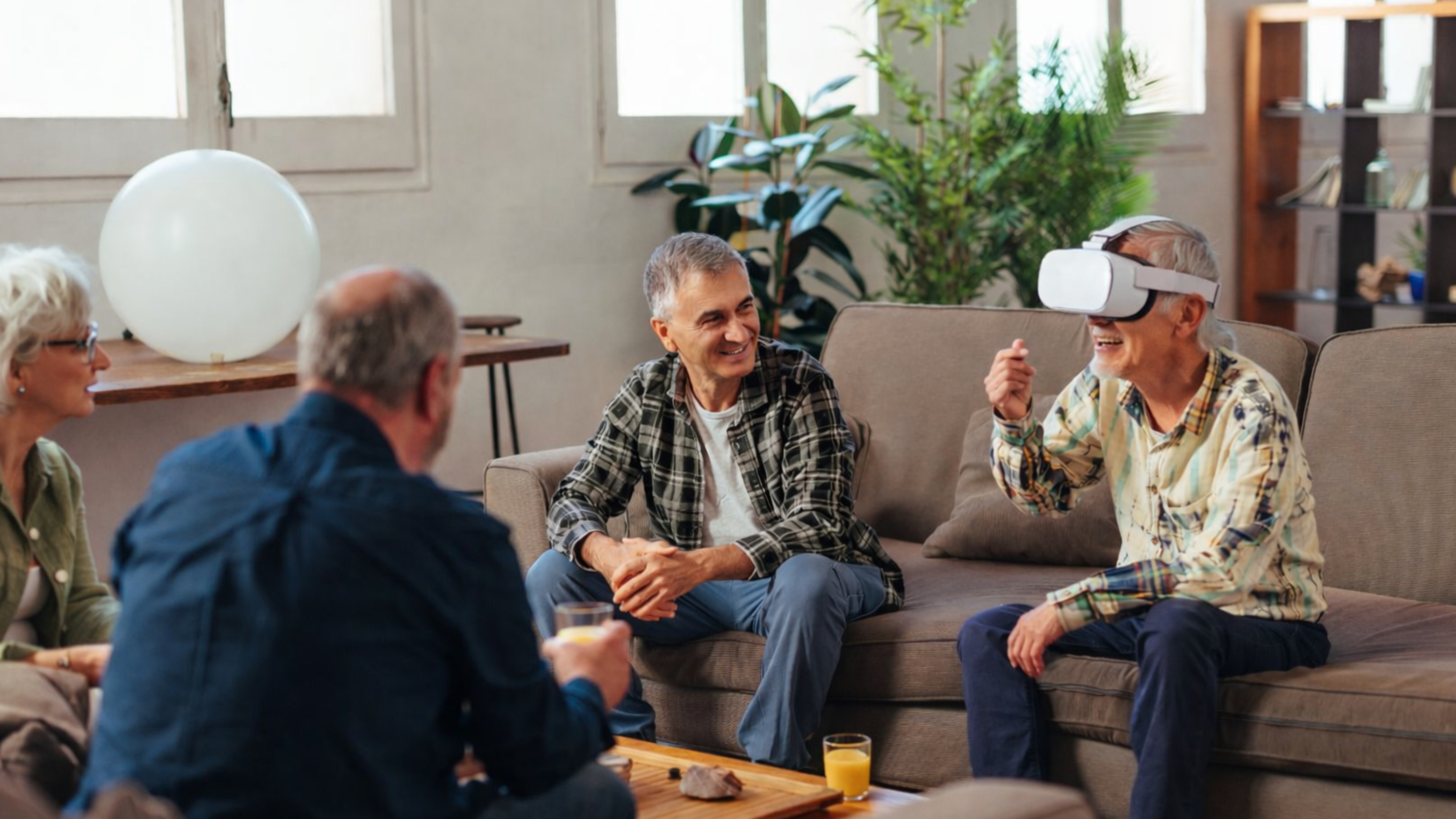 Seniors engaged in a seated VR workshop at a table